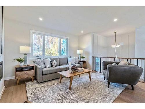 184 Huntchester Crescent Ne, Calgary, AB - Indoor Photo Showing Living Room With Fireplace