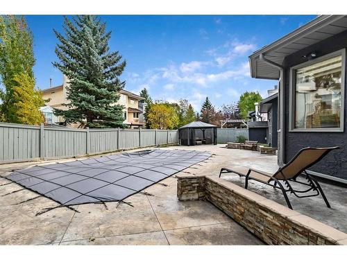 12940 Candle Crescent Sw, Calgary, AB - Outdoor With In Ground Pool