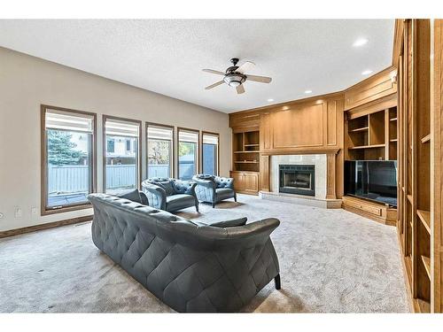 12940 Candle Crescent Sw, Calgary, AB - Indoor Photo Showing Living Room With Fireplace