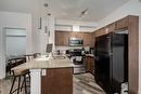 2115-604 East Lake Boulevard Se, Airdrie, AB  - Indoor Photo Showing Kitchen With Stainless Steel Kitchen With Double Sink 