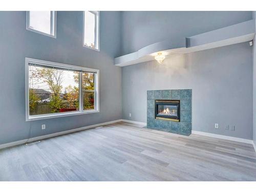 84 Douglas Glen Crescent Se, Calgary, AB - Indoor Photo Showing Living Room With Fireplace