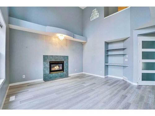 84 Douglas Glen Crescent Se, Calgary, AB - Indoor Photo Showing Other Room With Fireplace