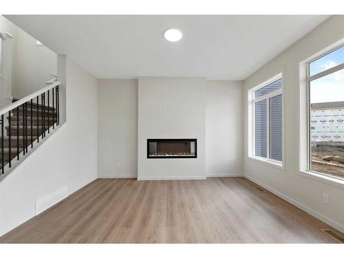 41 Corner Glen Road Ne, Calgary, AB - Indoor Photo Showing Living Room With Fireplace