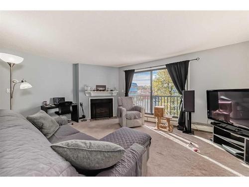 304-1512 16 Avenue Sw, Calgary, AB - Indoor With Fireplace