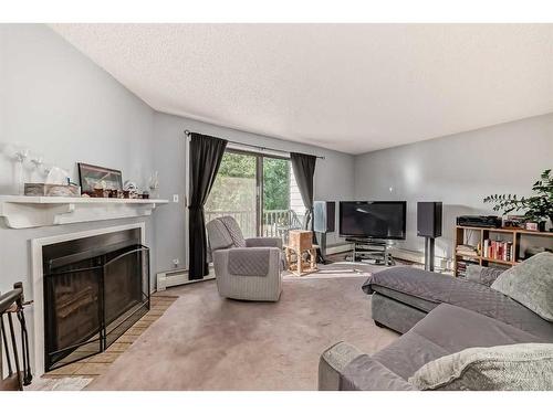 304-1512 16 Avenue Sw, Calgary, AB - Indoor Photo Showing Living Room With Fireplace