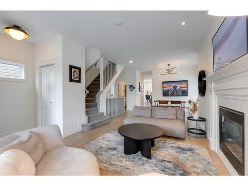 2201 31 Street Sw, Calgary, AB - Indoor Photo Showing Living Room With Fireplace