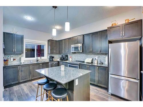 389 Midtown Gate Sw, Airdrie, AB - Indoor Photo Showing Kitchen With Upgraded Kitchen