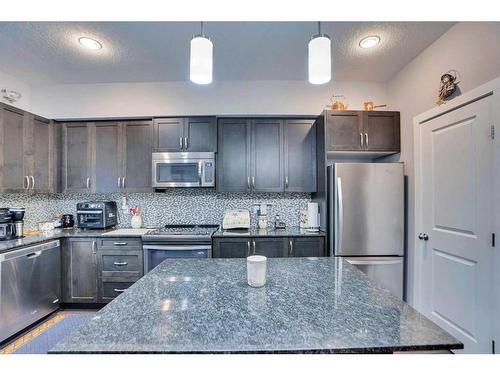 389 Midtown Gate Sw, Airdrie, AB - Indoor Photo Showing Kitchen With Upgraded Kitchen