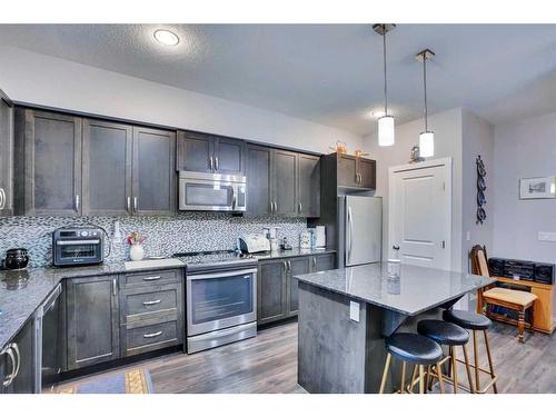 389 Midtown Gate Sw, Airdrie, AB - Indoor Photo Showing Kitchen With Upgraded Kitchen