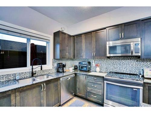 389 Midtown Gate Sw, Airdrie, AB - Indoor Photo Showing Kitchen With Double Sink With Upgraded Kitchen