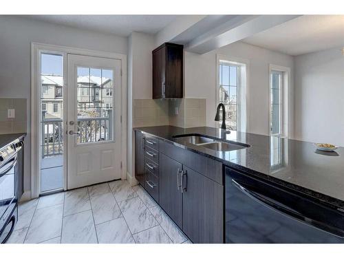 14 Windstone Green Sw, Airdrie, AB - Indoor Photo Showing Kitchen With Double Sink