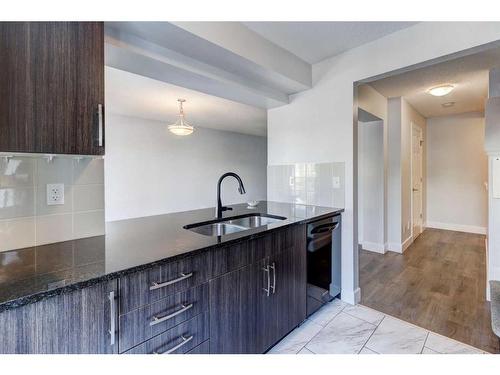 14 Windstone Green Sw, Airdrie, AB - Indoor Photo Showing Kitchen With Double Sink