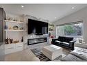 131 Mapleburn Drive Se, Calgary, AB  - Indoor Photo Showing Living Room With Fireplace 