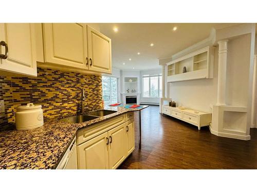 310-108 Edgeridge Terrace Nw, Calgary, AB - Indoor Photo Showing Kitchen With Double Sink