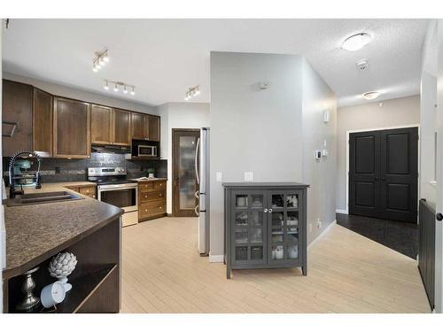 38 Sage Valley Manor Nw, Calgary, AB - Indoor Photo Showing Kitchen With Double Sink