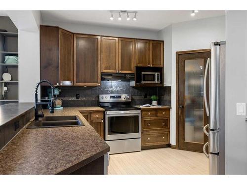 38 Sage Valley Manor Nw, Calgary, AB - Indoor Photo Showing Kitchen With Stainless Steel Kitchen With Double Sink