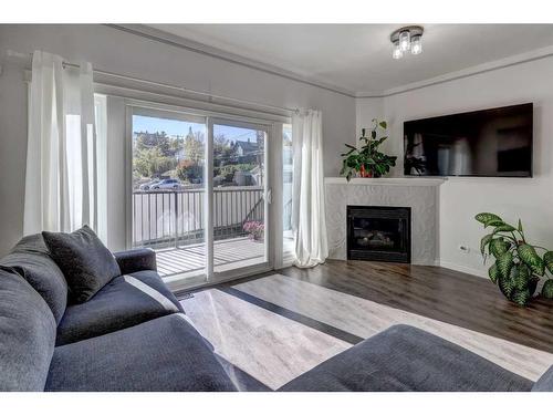 1713 23 Avenue Sw, Calgary, AB - Indoor Photo Showing Living Room With Fireplace