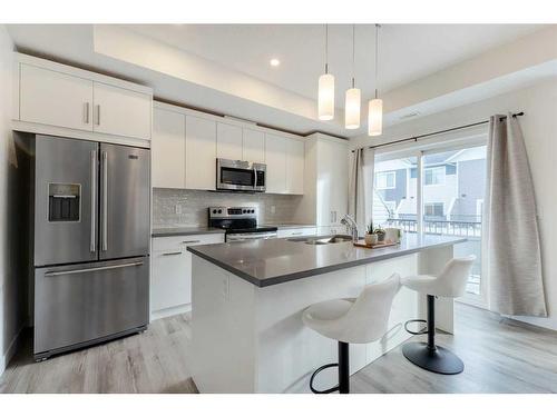 479 Canals Crossing, Airdrie, AB - Indoor Photo Showing Kitchen With Stainless Steel Kitchen With Upgraded Kitchen