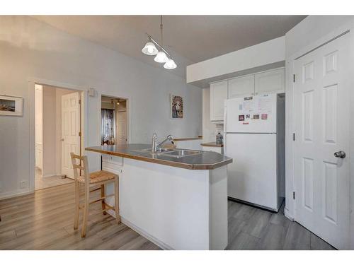 205 Somerset Drive Sw, Calgary, AB - Indoor Photo Showing Kitchen With Double Sink