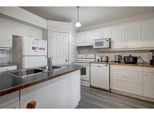 205 Somerset Drive Sw, Calgary, AB - Indoor Photo Showing Kitchen With Double Sink