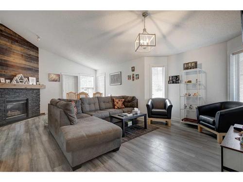 205 Somerset Drive Sw, Calgary, AB - Indoor Photo Showing Living Room With Fireplace