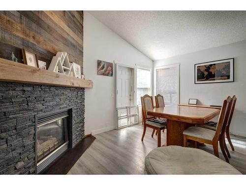 205 Somerset Drive Sw, Calgary, AB - Indoor With Fireplace