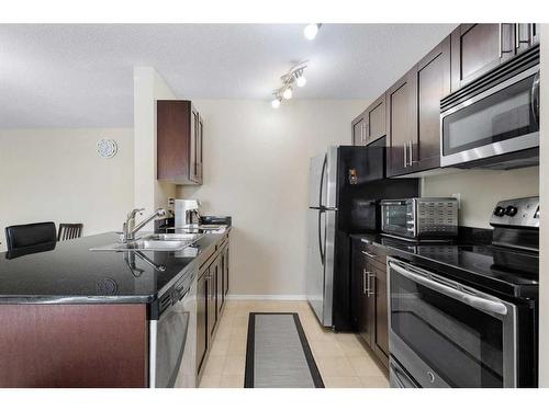 124-195 Kincora Glen Road Nw, Calgary, AB - Indoor Photo Showing Kitchen