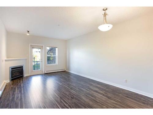 205-1414 17 Street Se, Calgary, AB - Indoor Photo Showing Other Room With Fireplace