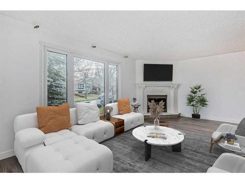 39 Bermuda Drive Nw, Calgary, AB - Indoor Photo Showing Living Room With Fireplace