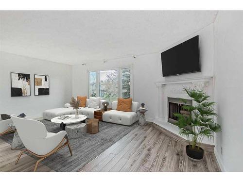 39 Bermuda Drive Nw, Calgary, AB - Indoor Photo Showing Living Room With Fireplace