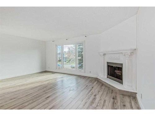 39 Bermuda Drive Nw, Calgary, AB - Indoor Photo Showing Living Room With Fireplace