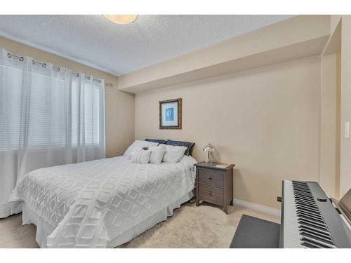 1208-450 Sage Valley Drive Nw, Calgary, AB - Indoor Photo Showing Bedroom