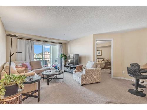 1208-450 Sage Valley Drive Nw, Calgary, AB - Indoor Photo Showing Living Room