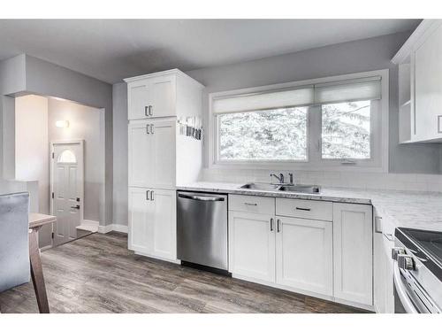 64 Healy Drive Sw, Calgary, AB - Indoor Photo Showing Kitchen With Double Sink