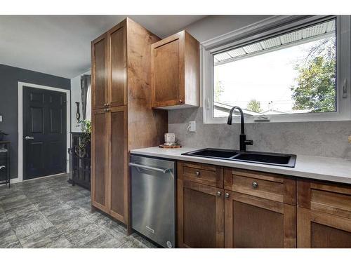 9616 Alcott Road Se, Calgary, AB - Indoor Photo Showing Kitchen With Double Sink