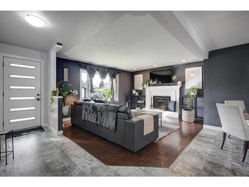 9616 Alcott Road Se, Calgary, AB - Indoor Photo Showing Living Room With Fireplace