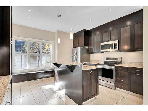 2801 Dallaire Avenue Sw, Calgary, AB - Indoor Photo Showing Kitchen With Upgraded Kitchen