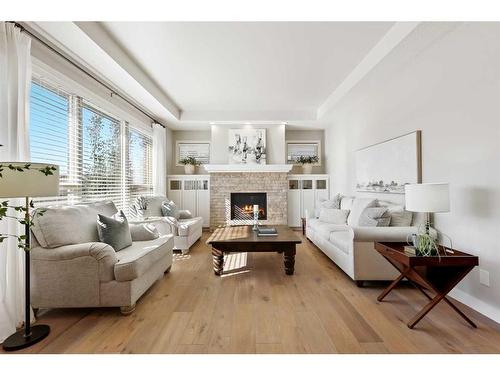 87 Cranbrook Way Se, Calgary, AB - Indoor Photo Showing Living Room With Fireplace