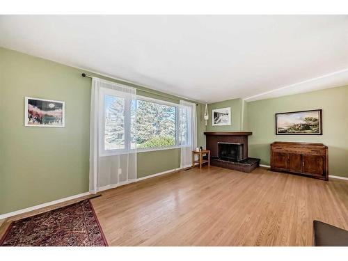 831 104 Avenue Sw, Calgary, AB - Indoor Photo Showing Living Room With Fireplace