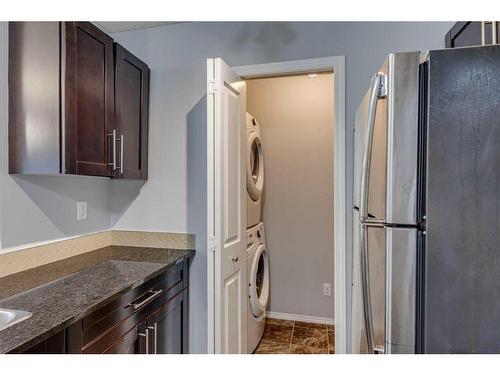 2310-1317 27 Street Se, Calgary, AB - Indoor Photo Showing Laundry Room