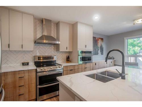 1035 Tuscany Drive Nw, Calgary, AB - Indoor Photo Showing Kitchen With Double Sink