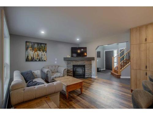 1035 Tuscany Drive Nw, Calgary, AB - Indoor Photo Showing Living Room With Fireplace