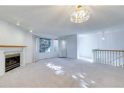 28 Richelieu Court Sw, Calgary, AB - Indoor With Fireplace