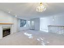 28 Richelieu Court Sw, Calgary, AB  - Indoor With Fireplace 