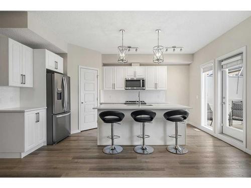 110-32 Red Embers Parade Ne, Calgary, AB - Indoor Photo Showing Kitchen With Double Sink