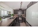 1606-210 15 Avenue Se, Calgary, AB  - Indoor Photo Showing Kitchen With Double Sink 