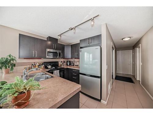 1606-210 15 Avenue Se, Calgary, AB - Indoor Photo Showing Kitchen With Double Sink