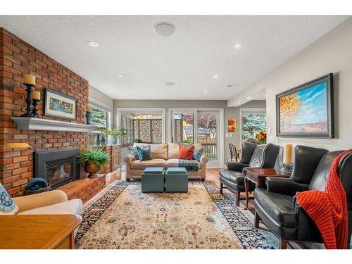 14936 Parkland Boulevard Se, Calgary, AB - Indoor Photo Showing Living Room With Fireplace