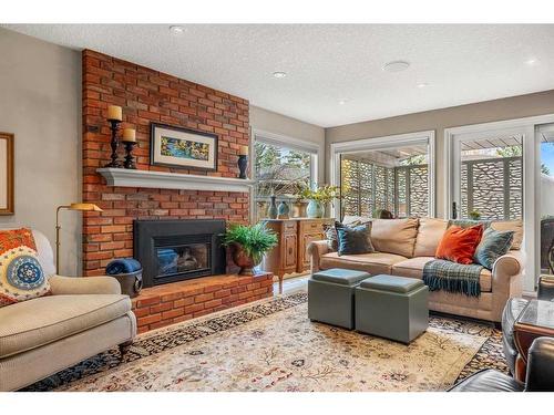 14936 Parkland Boulevard Se, Calgary, AB - Indoor Photo Showing Living Room With Fireplace