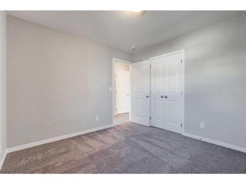 15 Heritage Heights, Cochrane, AB - Indoor Photo Showing Other Room